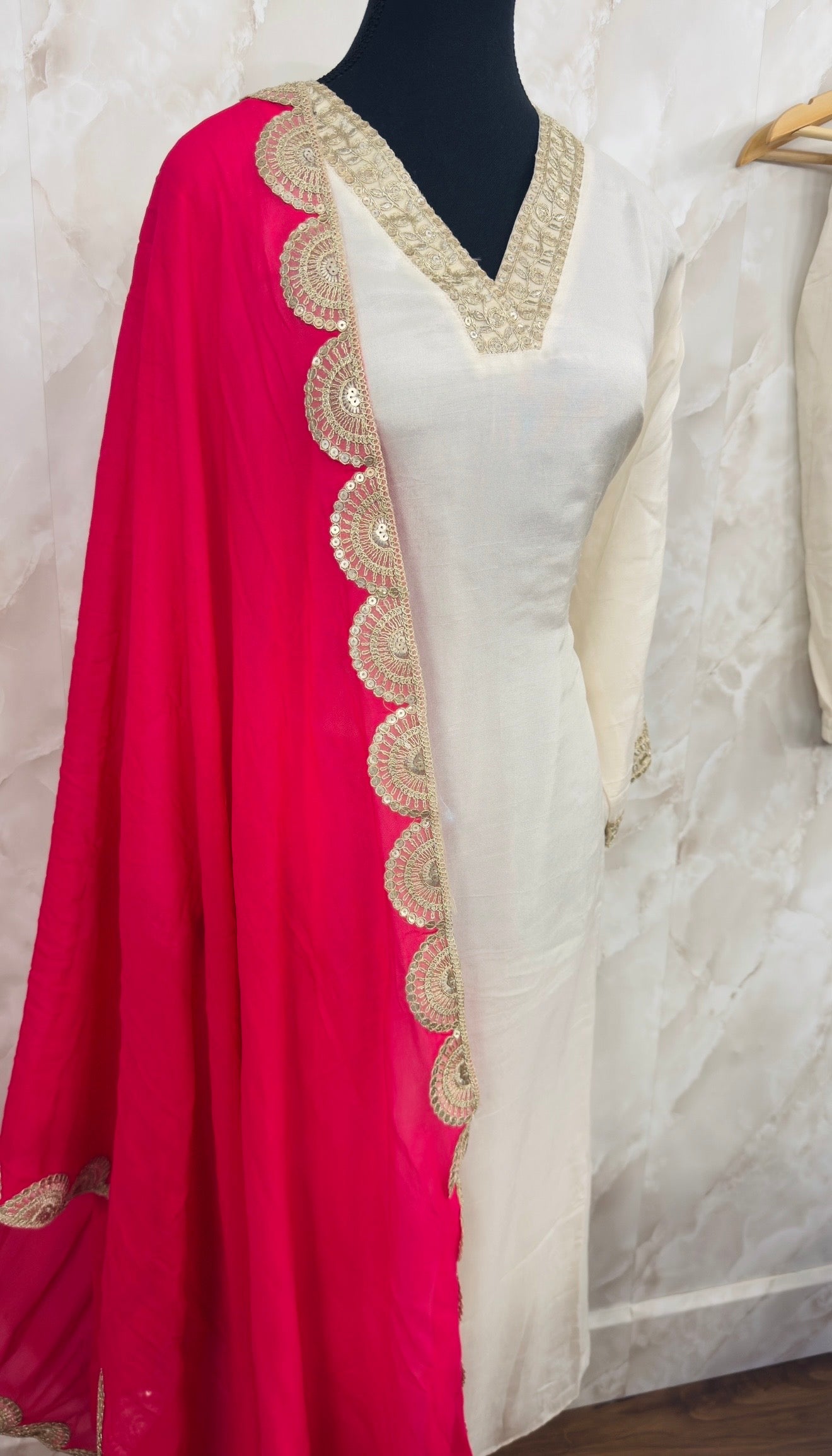 Off white suit with hot pink duppta